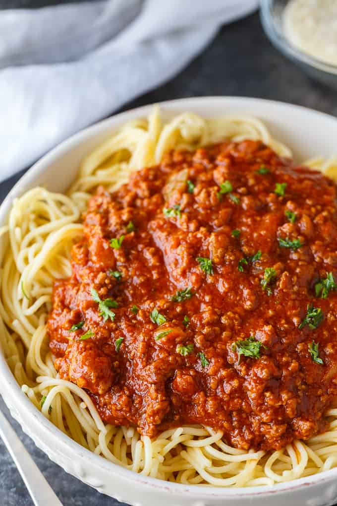 Homemade Spaghetti Sauce - This easy homemade sauce is filled with ground beef, tomatoes, onions, garlic, green peppers and spices. Made from scratch, it's one of the best pasta sauce recipes that everyone loves.