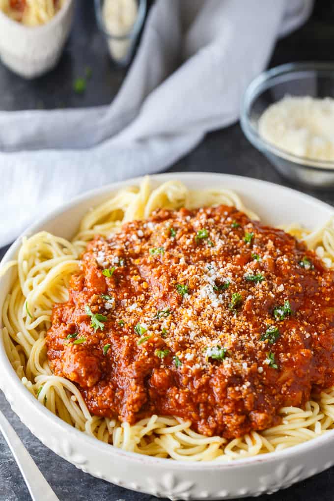 Homemade Spaghetti Sauce - This easy homemade sauce is filled with ground beef, tomatoes, onions, garlic, green peppers and spices. Made from scratch, it's one of the best pasta sauce recipes that everyone loves.