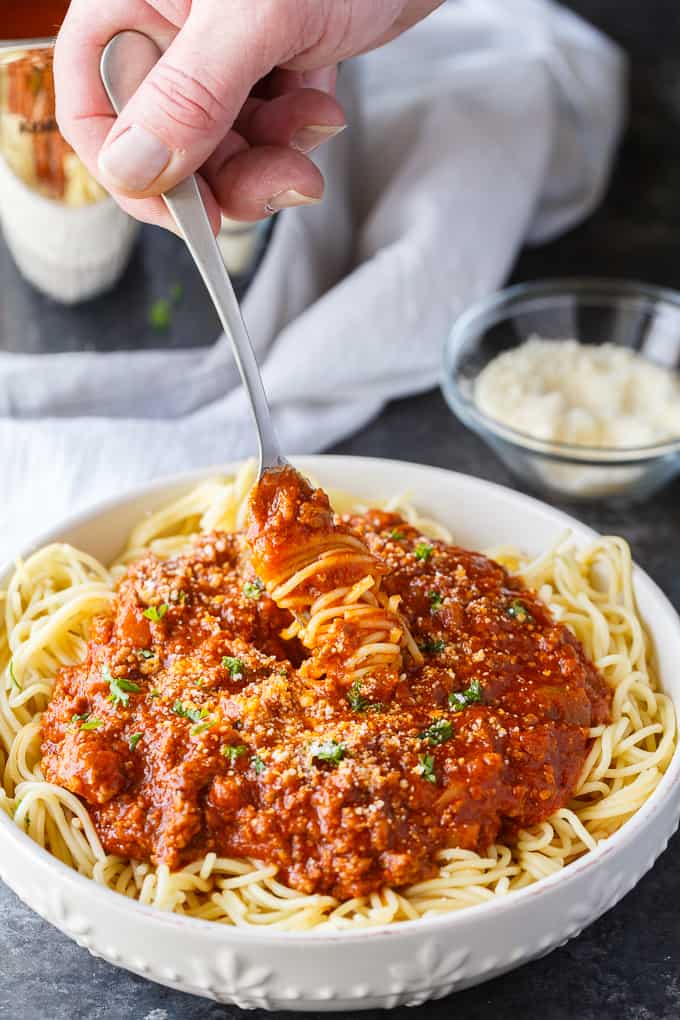 Homemade Spaghetti Sauce - This easy homemade sauce is filled with ground beef, tomatoes, onions, garlic, green peppers and spices. Made from scratch, it's one of the best pasta sauce recipes that everyone loves.