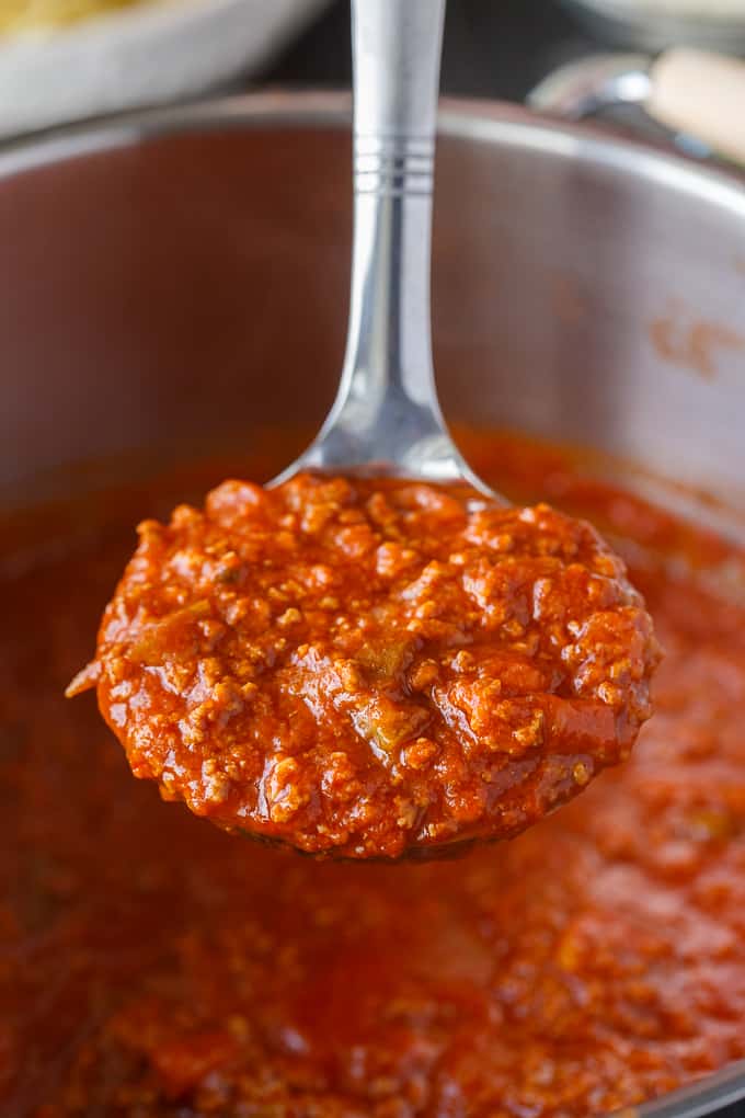 Homemade Spaghetti Sauce - This easy homemade sauce is filled with ground beef, tomatoes, onions, garlic, green peppers and spices. Made from scratch, it's one of the best pasta sauce recipes that everyone loves.