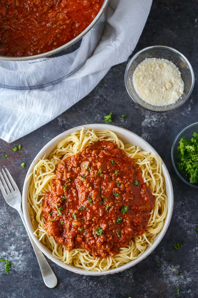 Homemade Spaghetti Sauce - This easy homemade sauce is filled with ground beef, tomatoes, onions, garlic, green peppers and spices. Made from scratch, it's one of the best pasta sauce recipes that everyone loves.