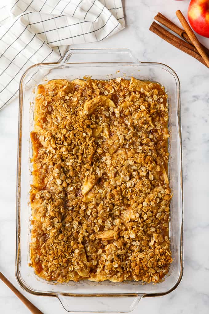 Apple Crisp - This simple old-fashioned dessert is baked with sweet and tart apples and topped with a brown sugar oat crumble. One of the best homemade fall desserts. Serve with vanilla ice cream for extra decadence.