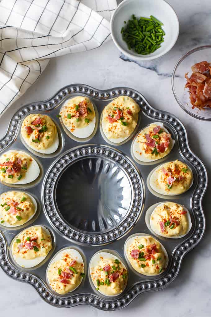 Bacon Ranch Deviled Eggs - A delicious savoury twist on classic deviled eggs! The filling is a divine mixture of creamy ranch dressing, bacon, Dijon mustard and chives. 