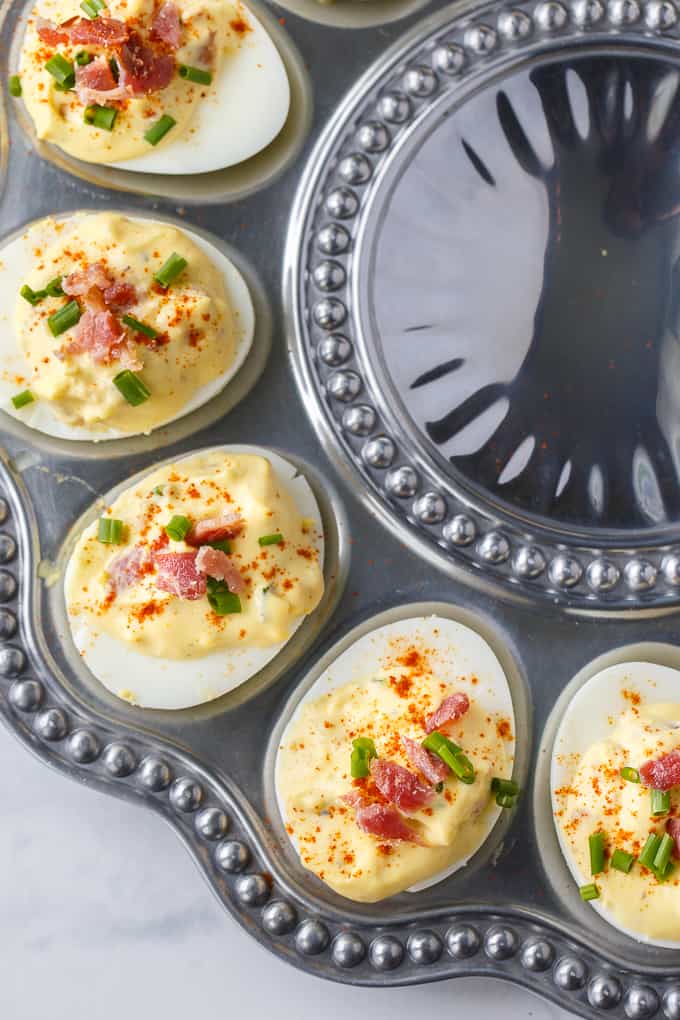 Bacon Ranch Deviled Eggs - A delicious savoury twist on classic deviled eggs! The filling is a divine mixture of creamy ranch dressing, bacon, Dijon mustard and chives. 