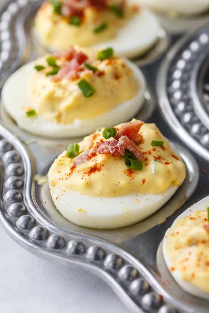 Bacon Ranch Deviled Eggs - A delicious savoury twist on classic deviled eggs! The filling is a divine mixture of creamy ranch dressing, bacon, Dijon mustard and chives. 