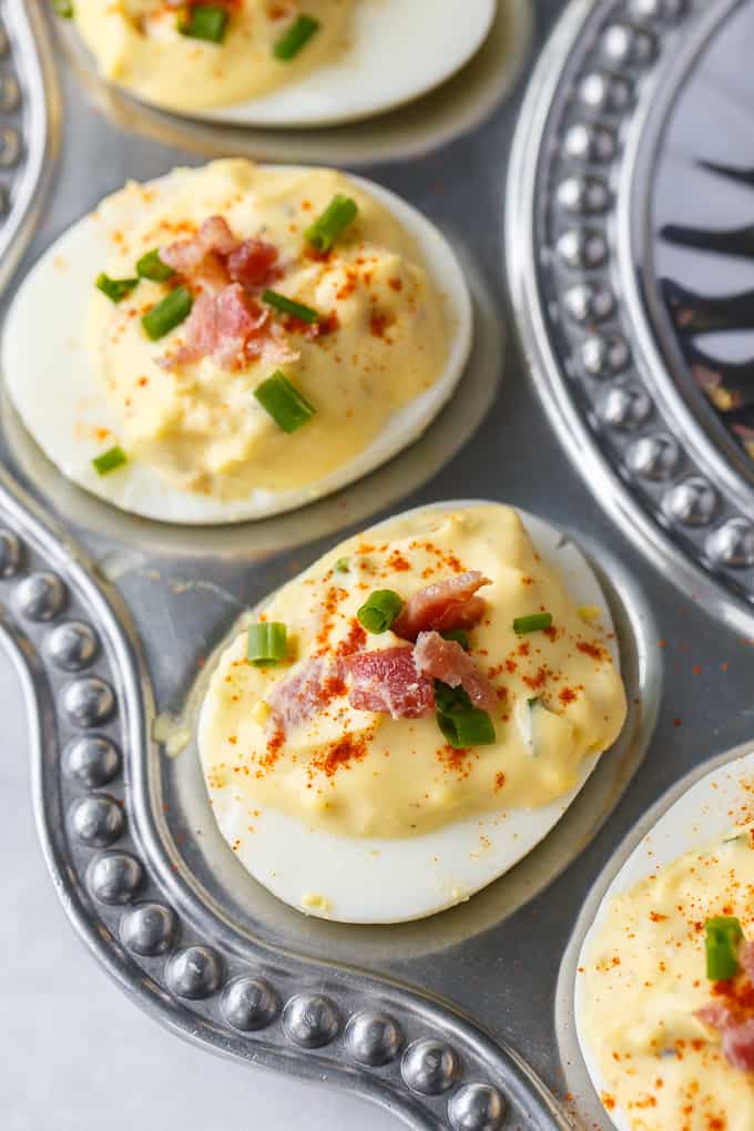 Bacon Ranch Deviled Eggs - A delicious savoury twist on classic deviled eggs! The filling is a divine mixture of creamy ranch dressing, bacon, Dijon mustard and chives. 