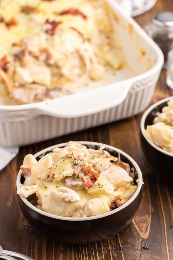 Chicken Alfredo Pierogi Casserole - Everyone who tries this easy baked casserole made from frozen pierogies raves about how amazing it is! This comfort food dinner recipe is loaded with chicken, bacon, Alfredo sauce, onions, mushrooms and pierogies.