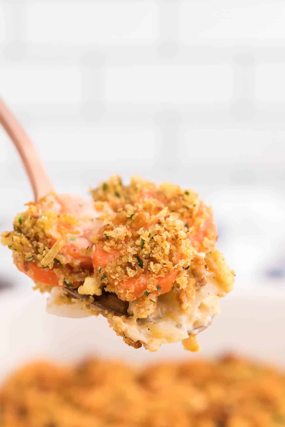 Carrot Casserole - This comforting vegetable side dish recipe is creamy, cheesy with a buttery stuffing topping. Baked to perfection, it's also kid-friendly and a delicious way to get your kids to eat more veggies.
