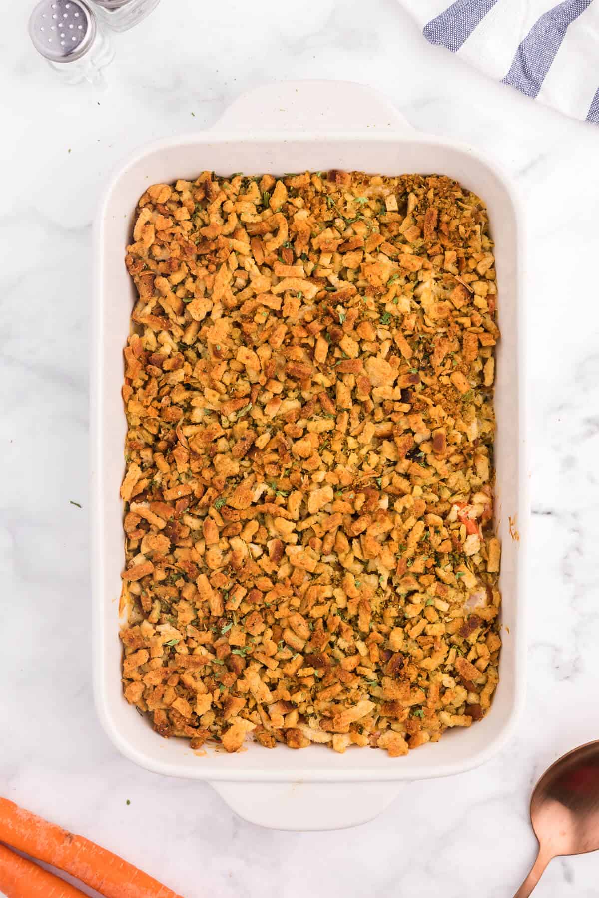 Carrot Casserole - This comforting vegetable side dish recipe is creamy, cheesy with a buttery stuffing topping. Baked to perfection, it's also kid-friendly and a delicious way to get your kids to eat more veggies.