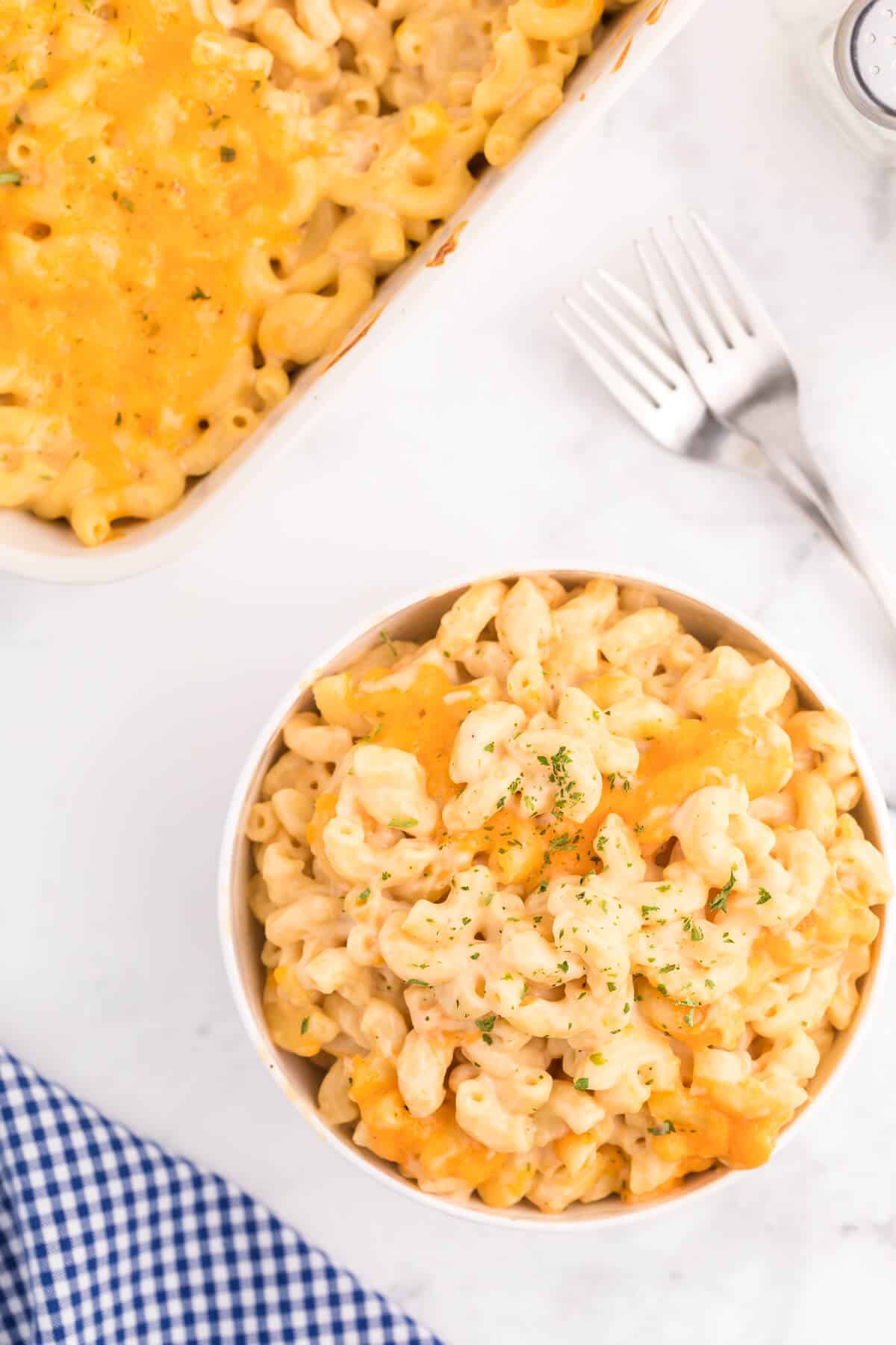 Baked Macaroni and Cheese - This old-fashioned classic recipe is a family favorite dinner and so easy to make. Tender elbow macaroni noodles are enveloped in an ultra creamy homemade cheese sauce and covered with melted cheddar cheese.