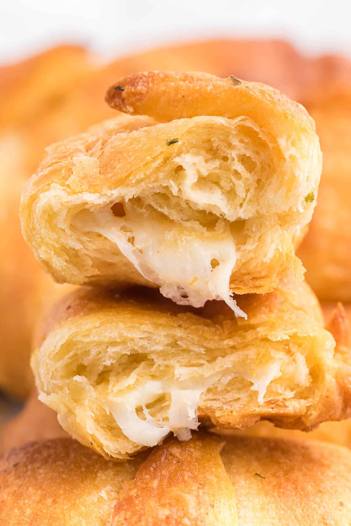 Air Fryer Garlic Cheese Stuffed Crescent Rolls Recipe - Use your air fryer to make this quick and easy snack or appetizer. Pillsbury crescent roll dough is brushed with garlic butter and wrapped around mozzarella cheese. Warning: they are addictive!