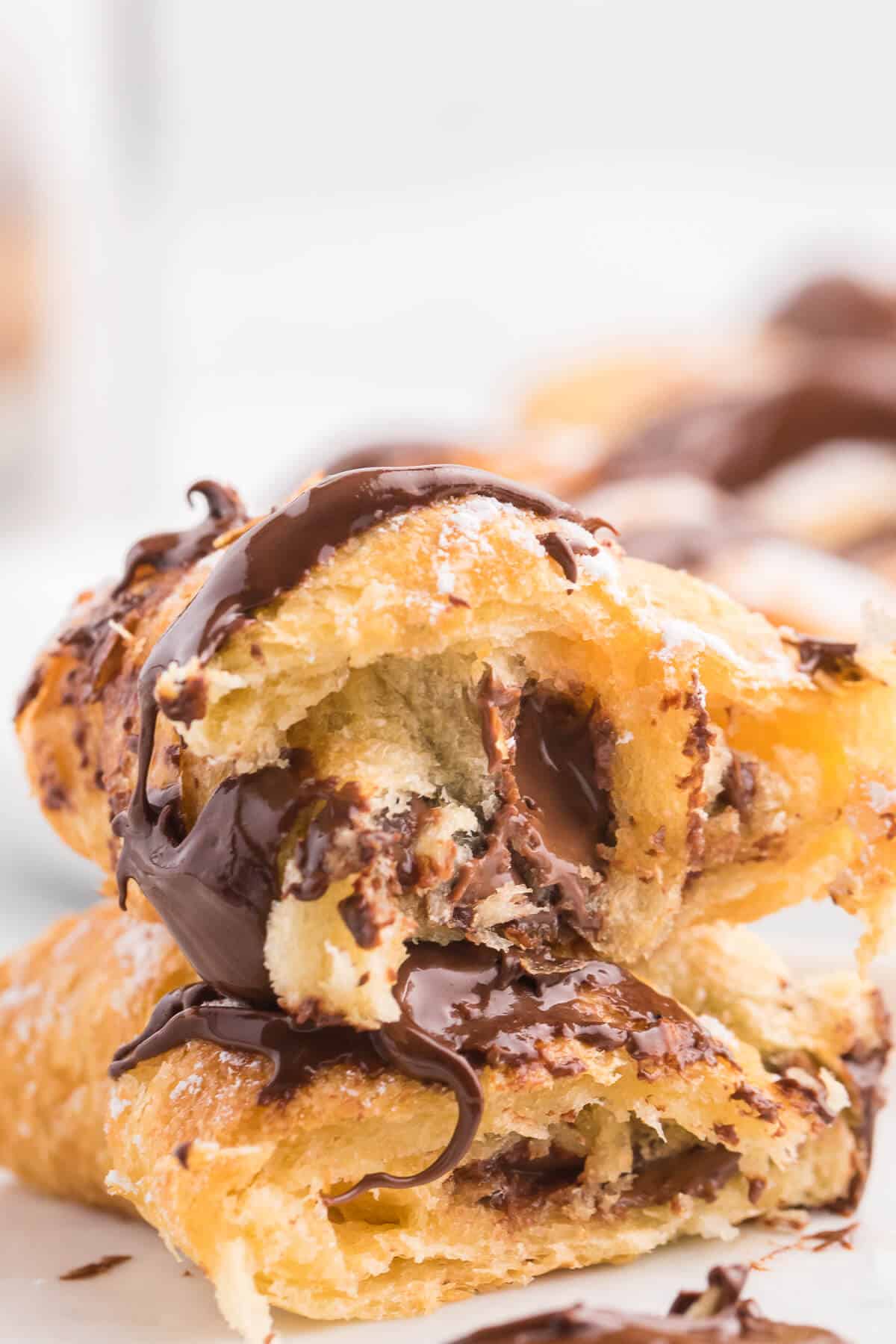 Air Fryer Chocolate Crescent Rolls Recipe - Make these chocolate stuffed crescent rolls in your air fryer. Wrap Pillsbury crescent roll dough around a spoonful of sweet and rich Nutella. Ready to eat in minutes! Such a delicious and easy dessert everyone loves.