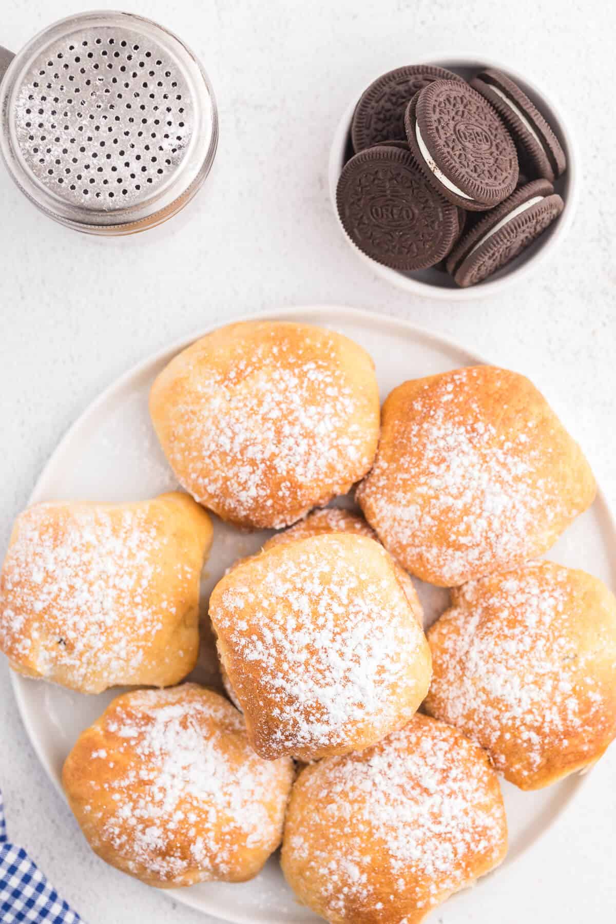 Air Fryer Oreos with Crescent Rolls - An easy and fun carnival treat made in the air fryer with crescent roll dough. Oreo cookies are enveloped in a sweet and golden crescent roll packet and topped with powdered sugar. Ready to eat in under 15 minutes!