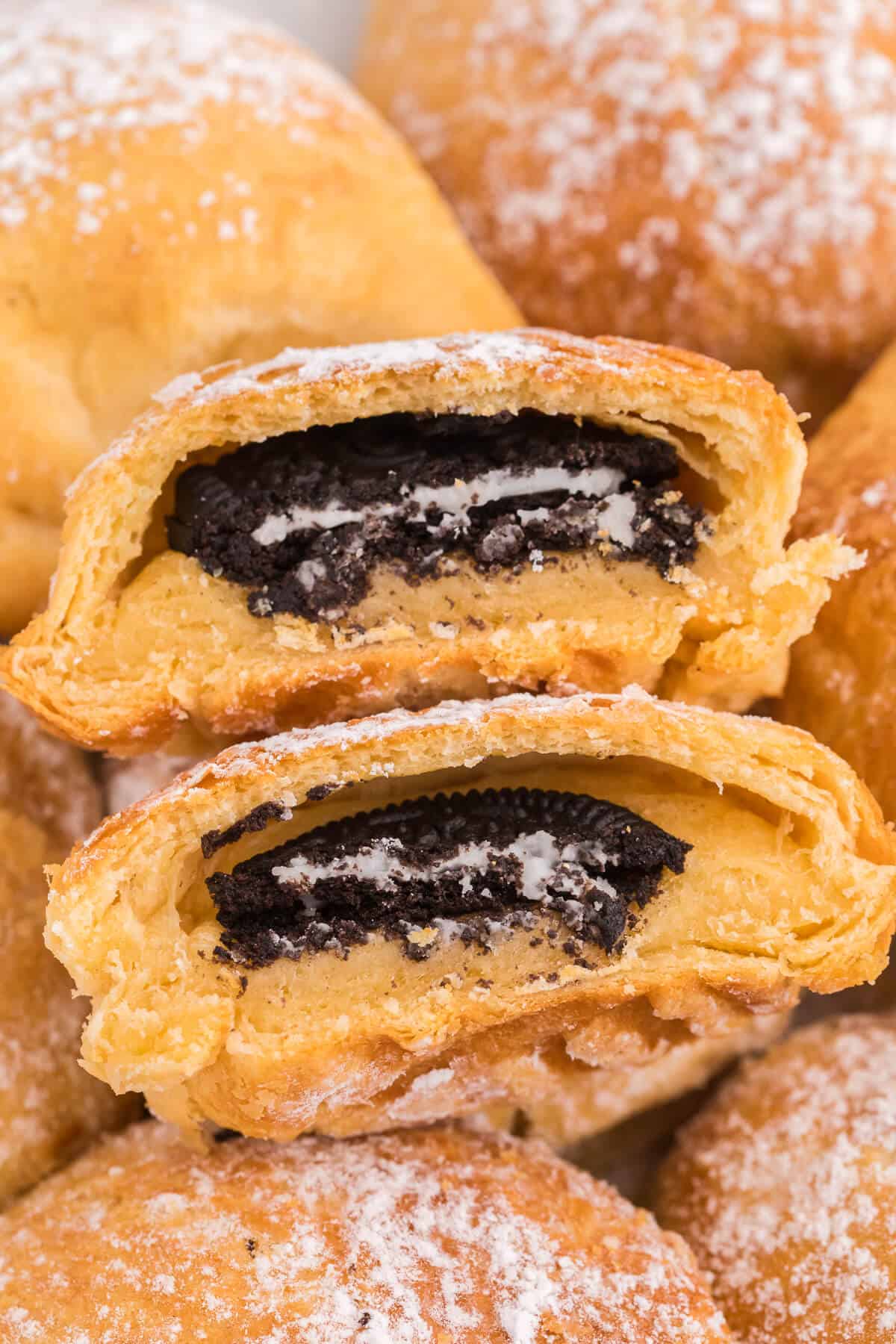 Stack of Air Fryer Oreos cut in half showing the inside.