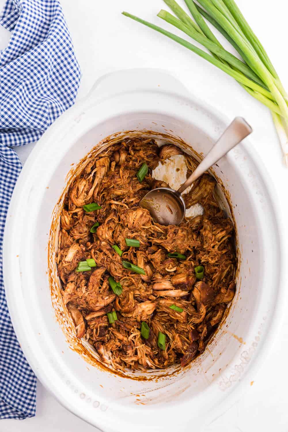 Slow Cooker Asian Chicken - This easy crockpot chicken is the perfect dinner for busy days. Tender chicken breasts are slow cooked in a flavorful sauce made with honey, garlic and spices. Serve over rice for a delicious family meal.