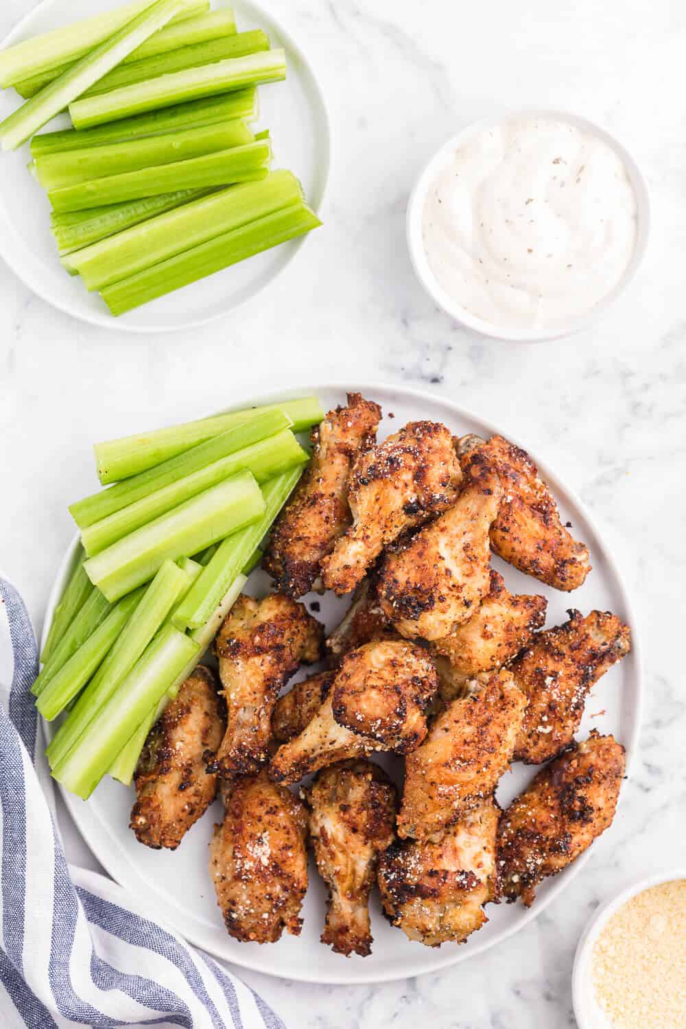 Air Fryer Chicken Wings Recipe - Use your air fryer to make the best crispy chicken wings in minutes! This easy appetizer is covered in a garlic, lemon pepper and Parmesan marinade for the most delicious flavor.