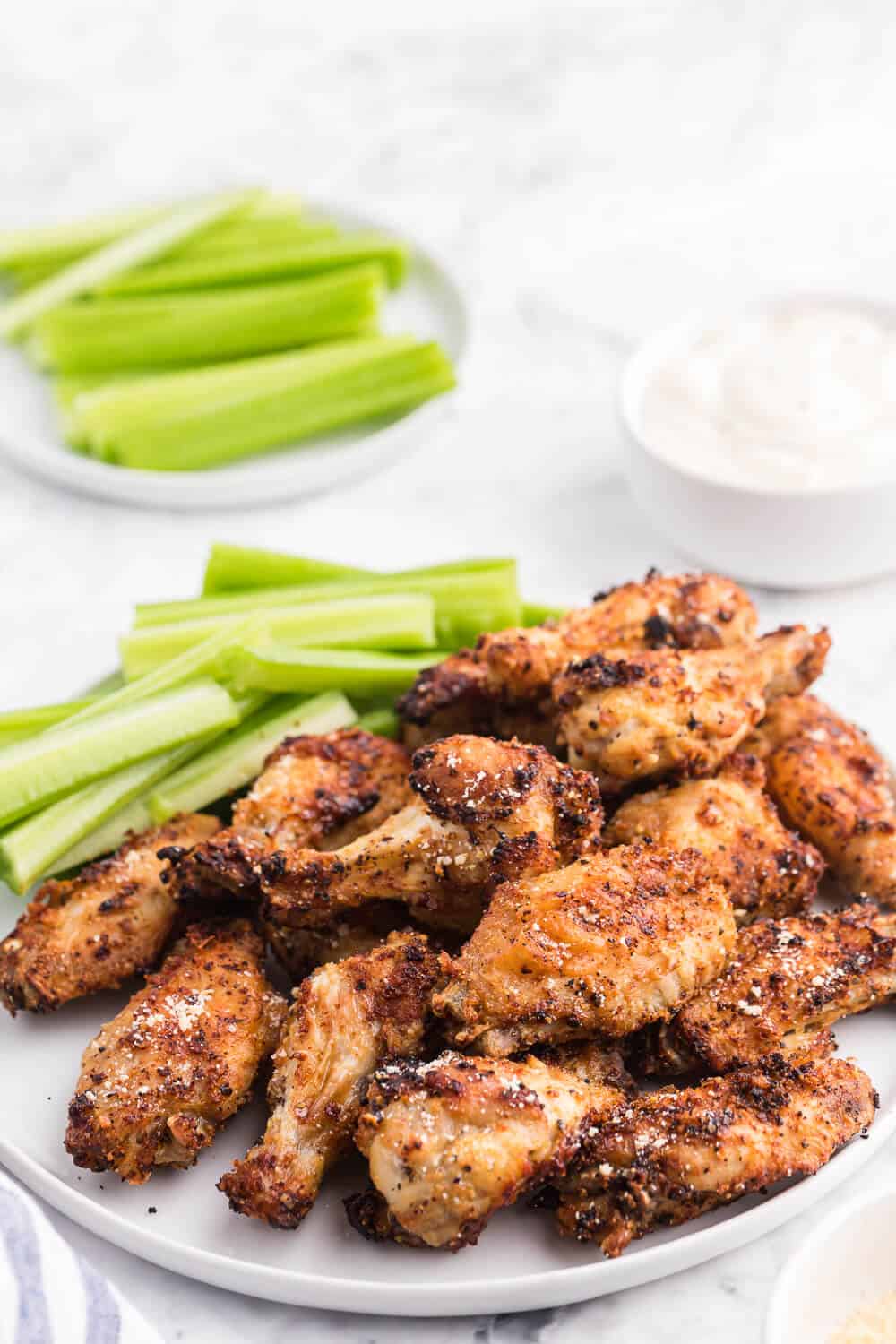 Air Fryer Chicken Wings Recipe - Use your air fryer to make the best crispy chicken wings in minutes! This easy appetizer is covered in a garlic, lemon pepper and Parmesan marinade for the most delicious flavor.