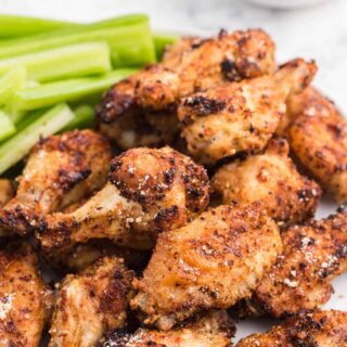 A plate of the recipe with celery sticks.