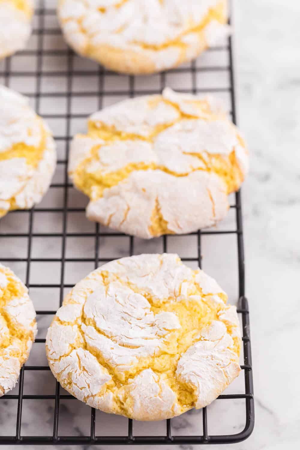 Cool Whip Cookies Recipe - One of the easiest cookie recipes you'll ever make. Grab a box of your favorite cake mix, Cool Whip, an egg and powdered sugar and get started! Create a variety of flavors like lemon, strawberry, red velvet, funfetti, chocolate and more.