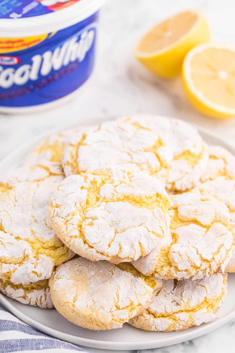 Cool Whip Cookies Recipe - One of the easiest cookie recipes you'll ever make. Grab a box of your favorite cake mix, Cool Whip, an egg and powdered sugar and get started! Create a variety of flavors like lemon, strawberry, red velvet, funfetti, chocolate and more.