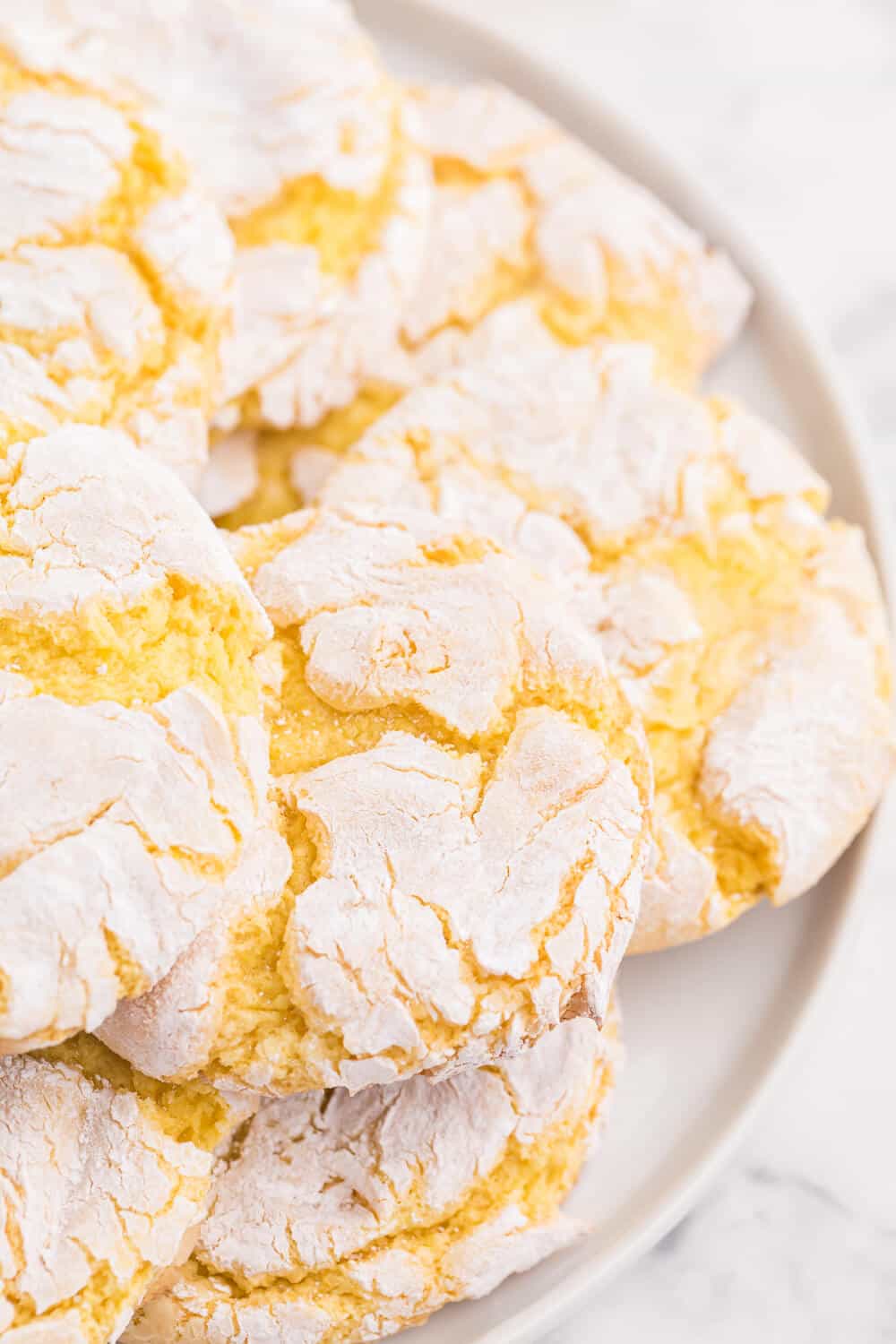 Cool Whip Cookies Recipe - One of the easiest cookie recipes you'll ever make. Grab a box of your favorite cake mix, Cool Whip, an egg and powdered sugar and get started! Create a variety of flavors like lemon, strawberry, red velvet, funfetti, chocolate and more.