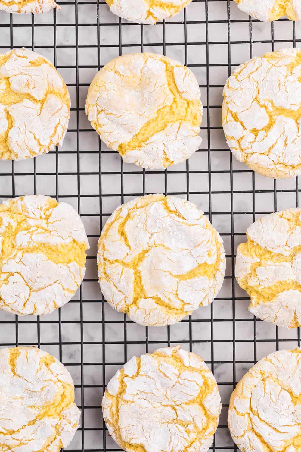 Cool Whip Cookies Recipe - One of the easiest cookie recipes you'll ever make. Grab a box of your favorite cake mix, Cool Whip, an egg and powdered sugar and get started! Create a variety of flavors like lemon, strawberry, red velvet, funfetti, chocolate and more.