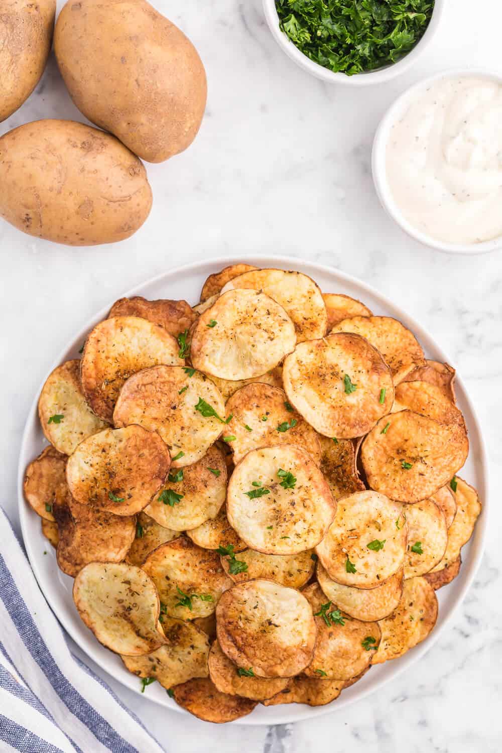 Air Fryer Potato Chips Recipe - These crispy homemade potato chips are super easy to make in the air fryer. Perfect for when you're craving a salty, crunchy snack with loads of flavor!