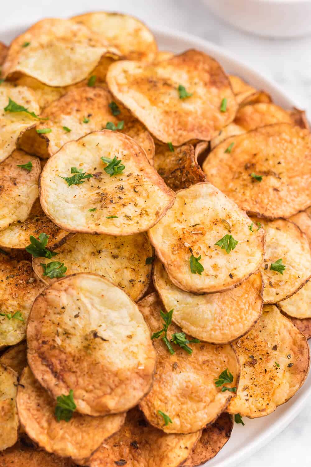 Air Fryer Potato Chips Recipe - These crispy homemade potato chips are super easy to make in the air fryer. Perfect for when you're craving a salty, crunchy snack with loads of flavor!