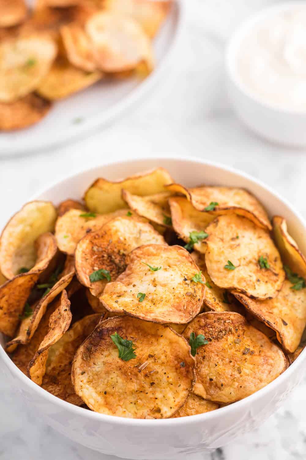 Air Fryer Potato Chips Recipe - These crispy homemade potato chips are super easy to make in the air fryer. Perfect for when you're craving a salty, crunchy snack with loads of flavor!