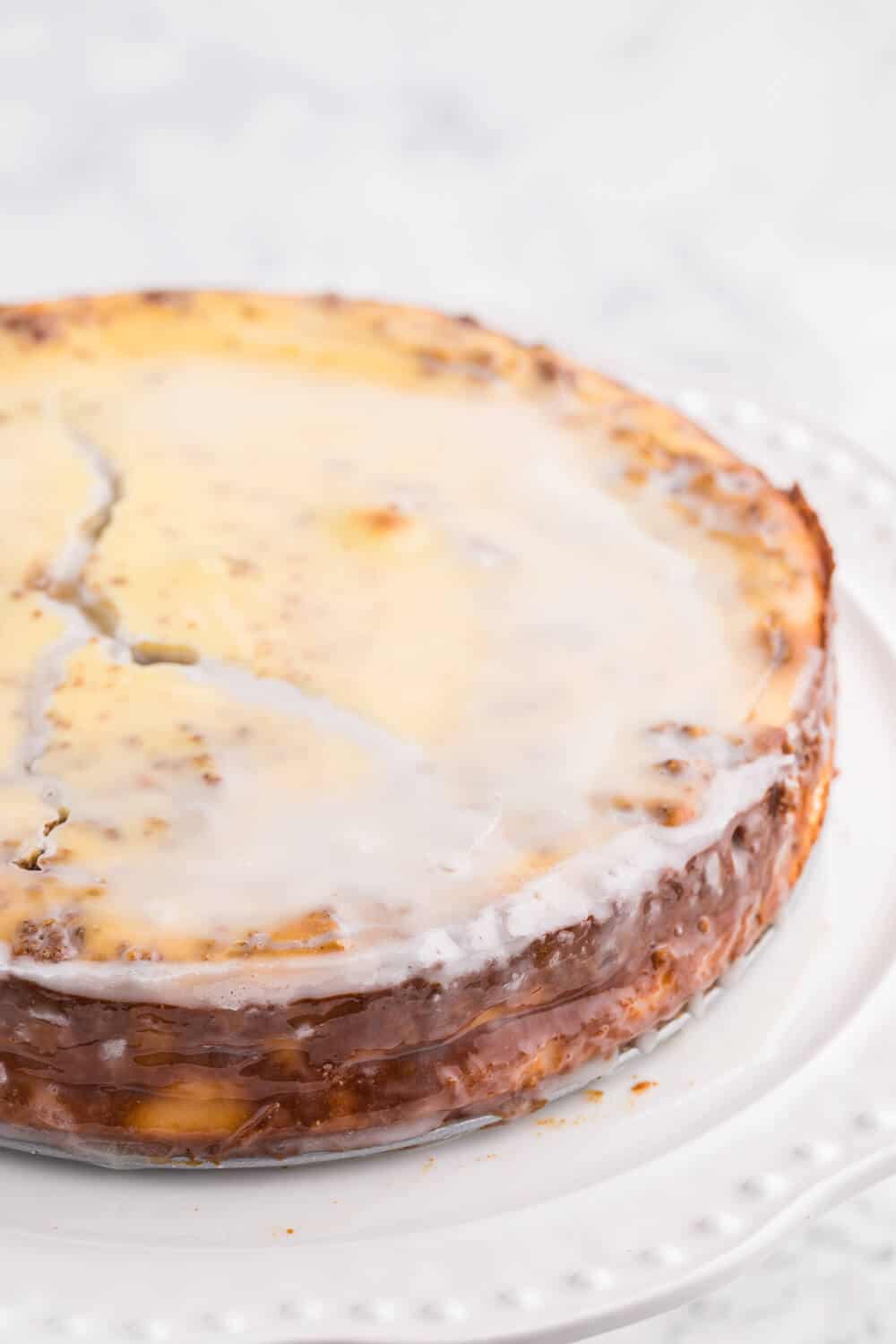 Cinnamon Roll Cheesecake Recipe on a white platter