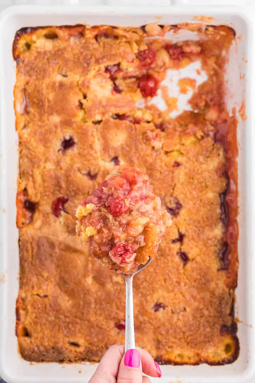 Cherry Pineapple Dump Cake Recipe - Made in 1 pan and only 4 ingredients in this quick and easy dessert recipe. Short prep time and no mixing! Perfect for potlucks and cookouts.