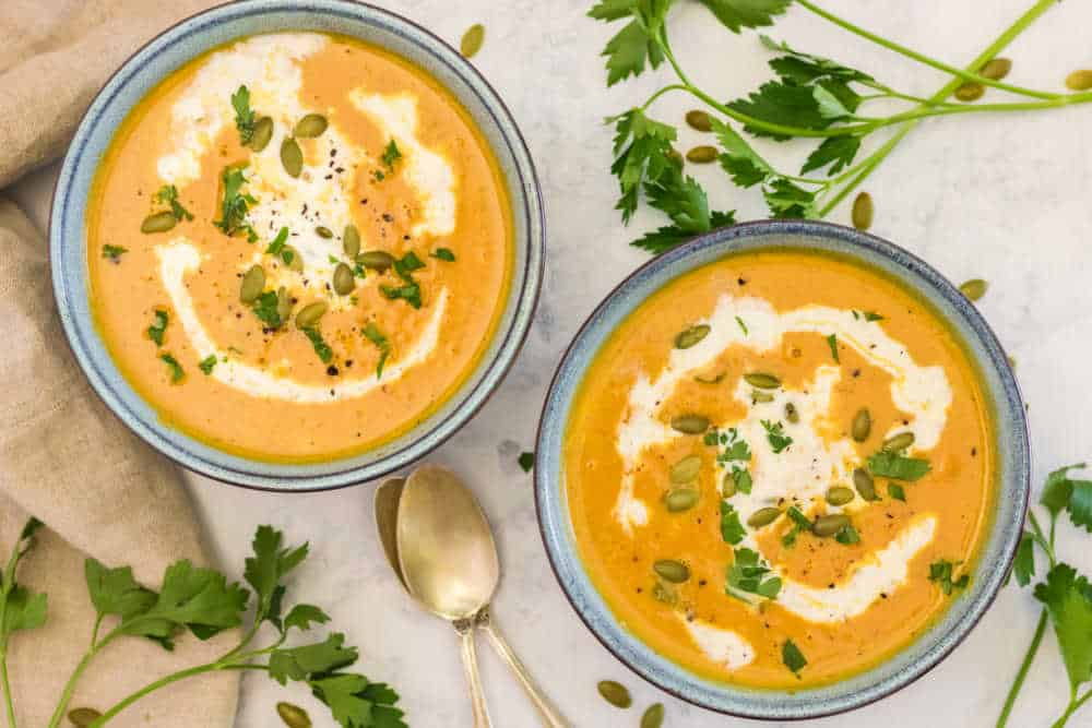 two bowls of pumpkin soup