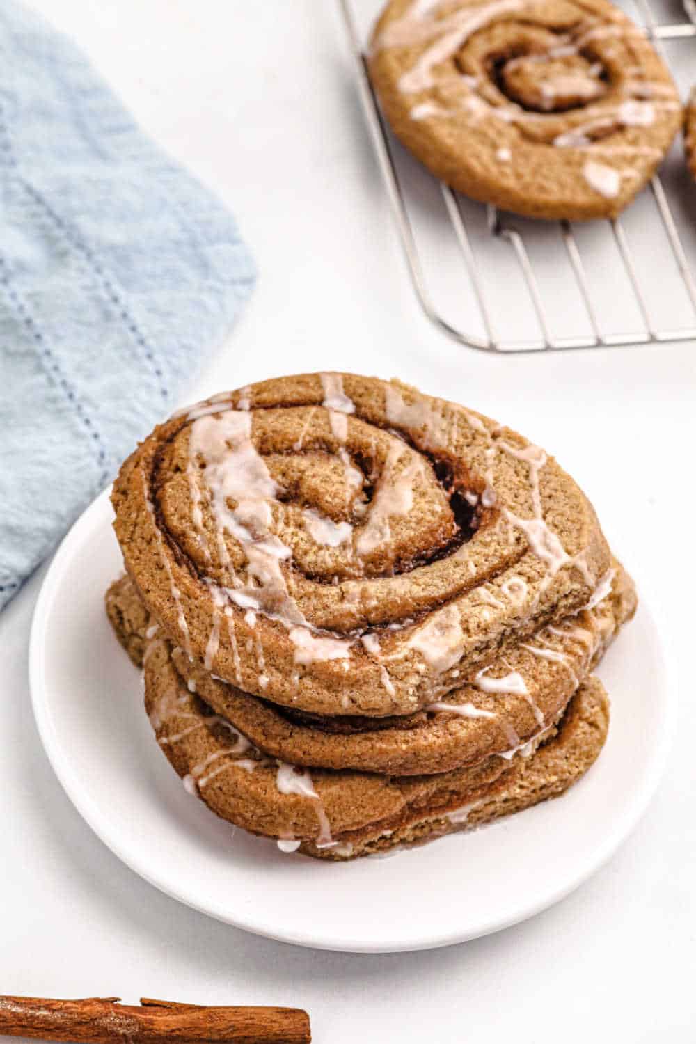 A stack of cinnamon roll cookies on a plate