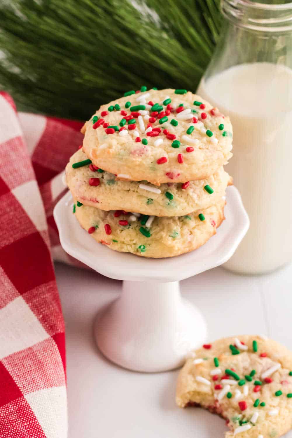 a stack of christmas cake mix cookies on a cupcake stand