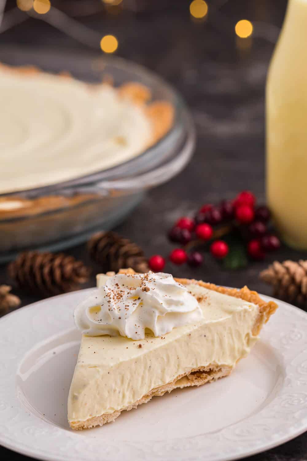 A slice of eggnog pie on a white plate