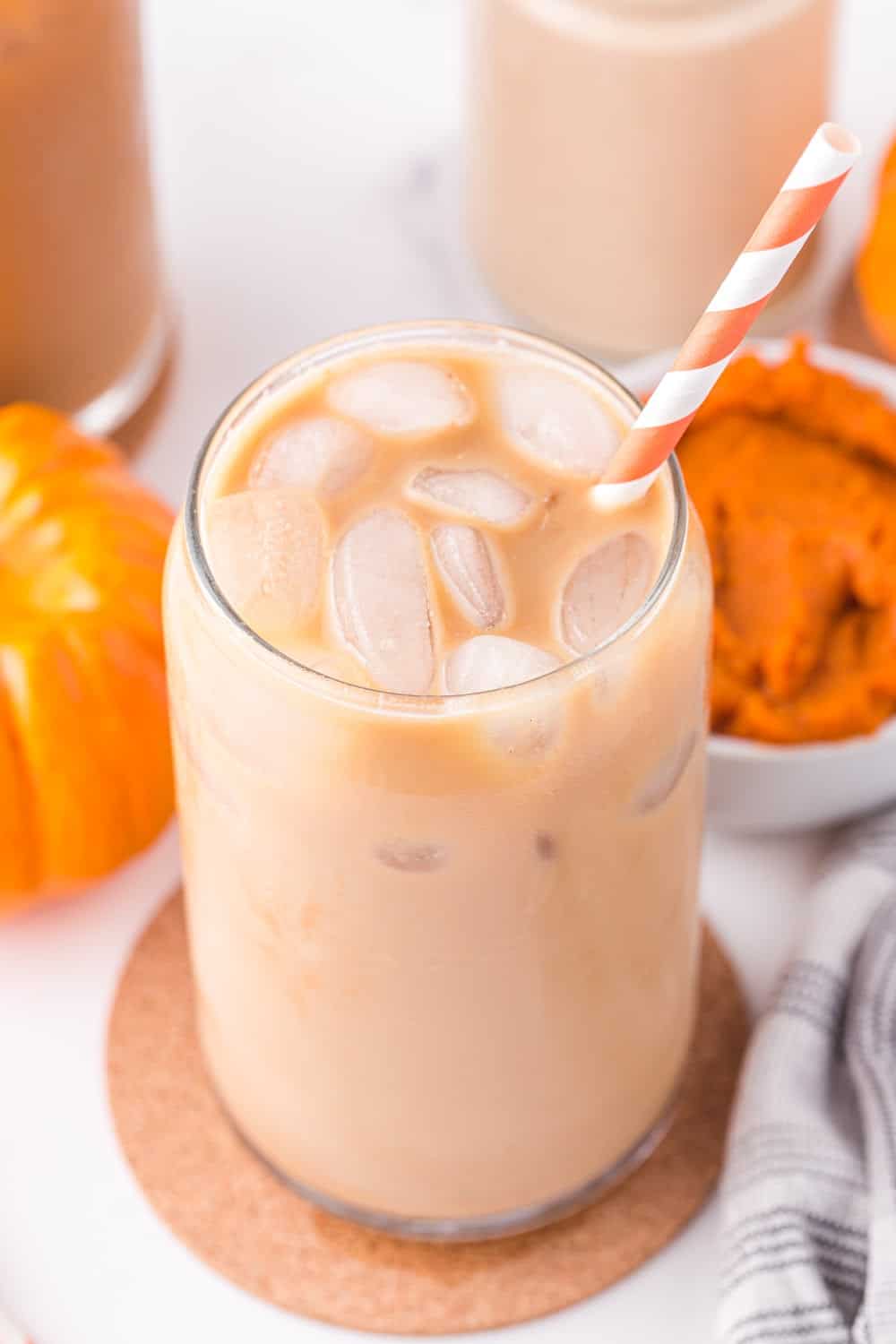 iced coffee with pumpkin spice creamer in a jar