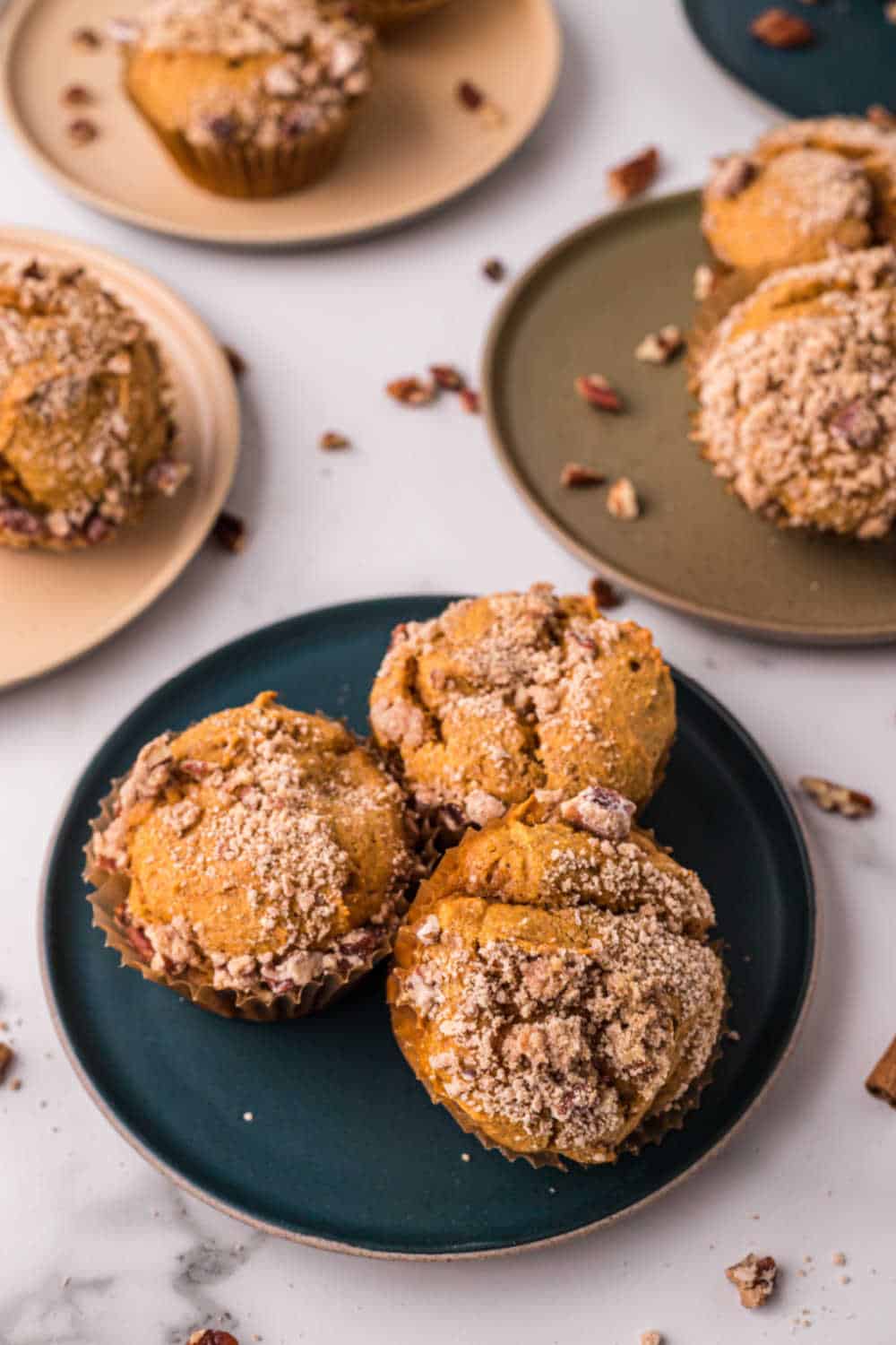 Pumpkin crumb muffins on colored plates