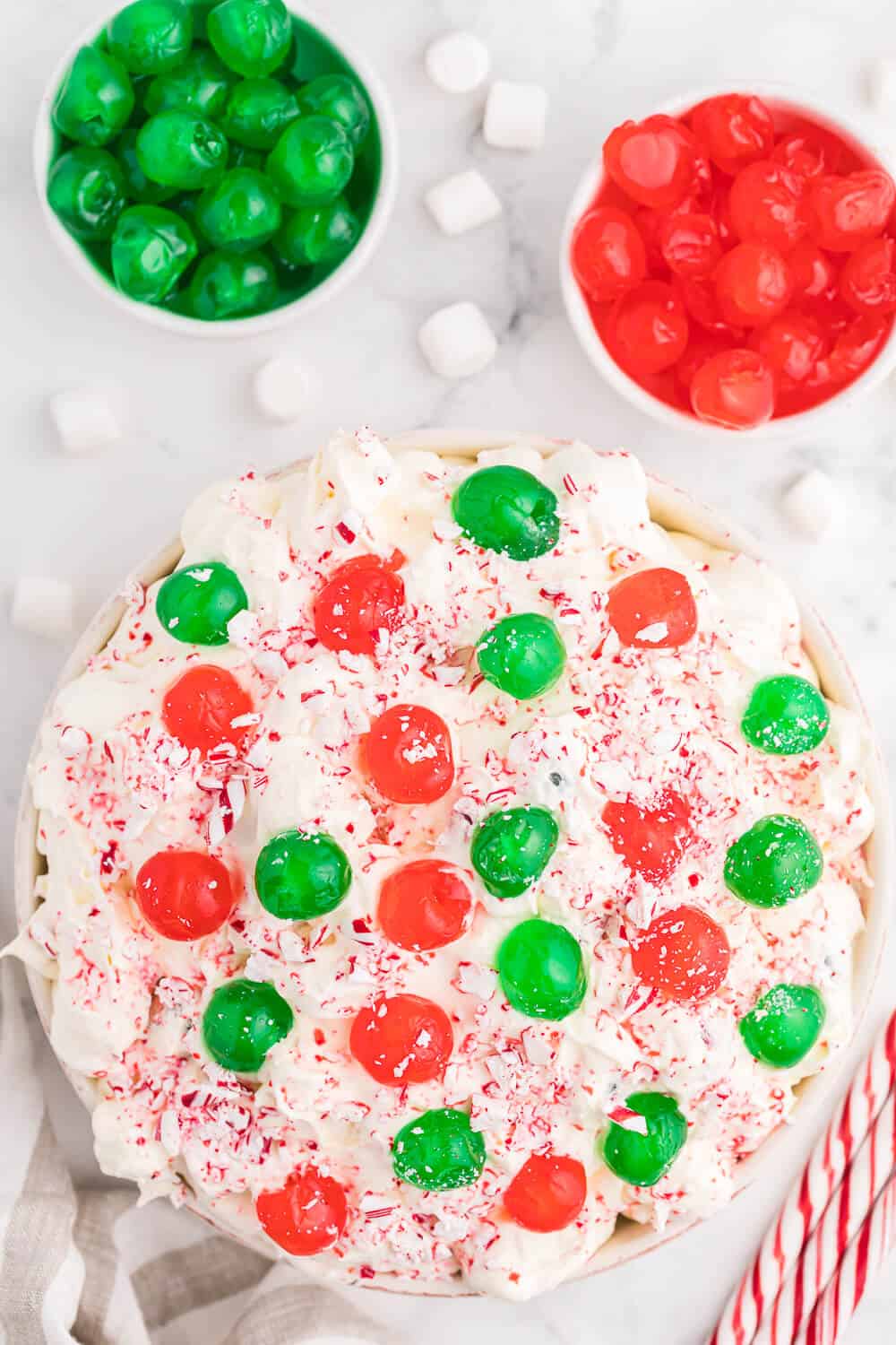 christmas fluff in a serving bowl with glace cherries in small bowls 