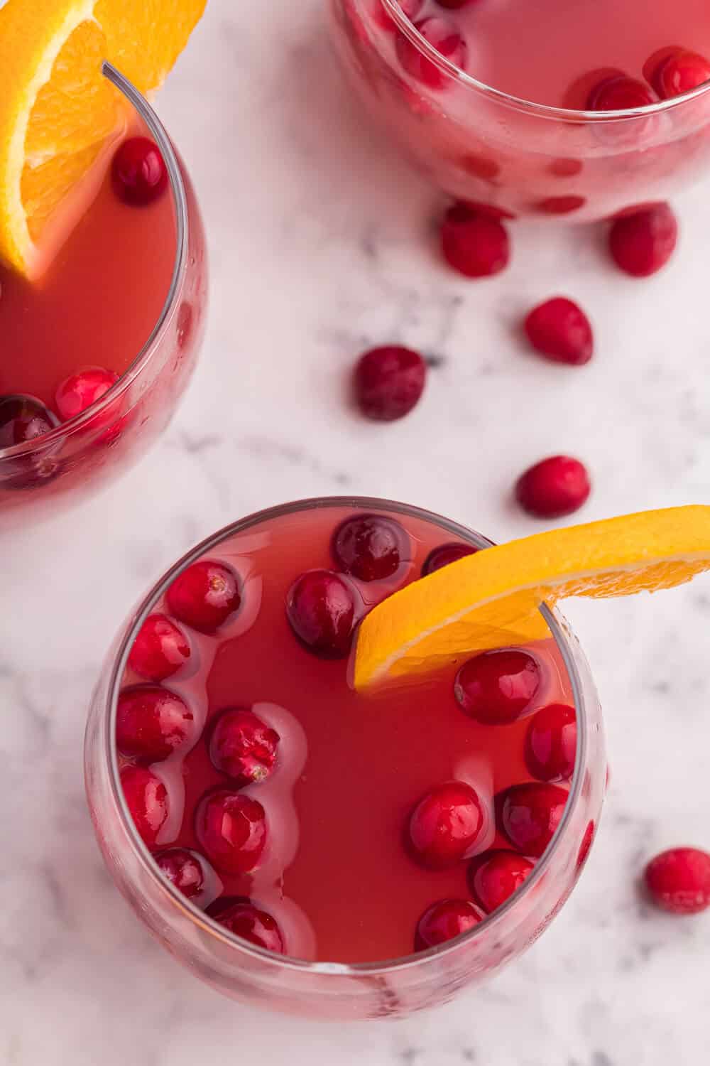 punch glasses filled with Christmas party punch