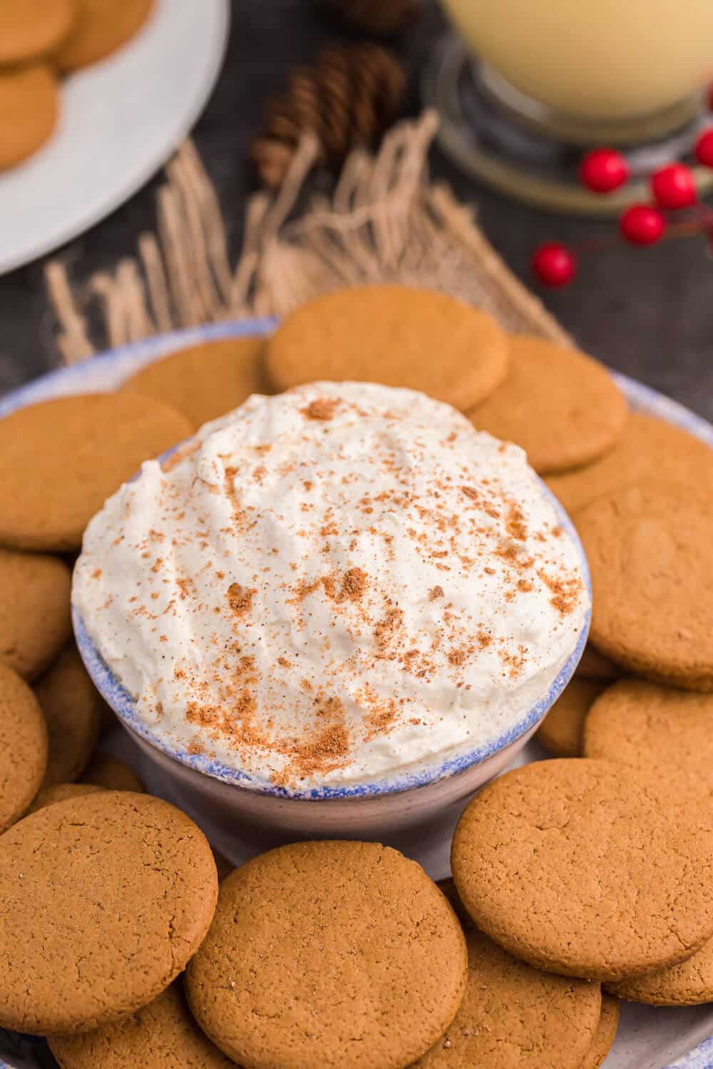 eggnog dip in a serving bowl with gingersnap cookies