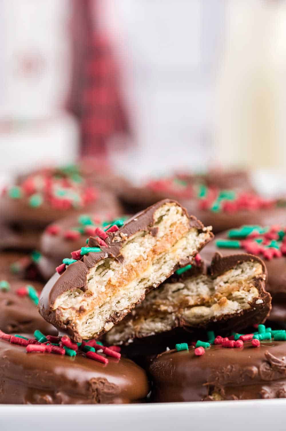 A ritz cracker cookie cut in half on a bunch of cookies