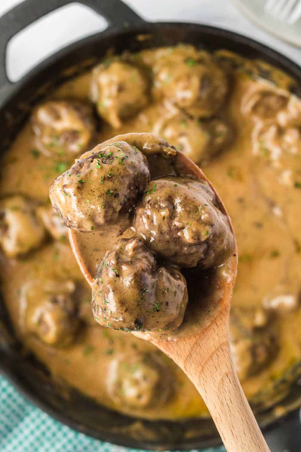 Swedish meatballs on a serving spoon