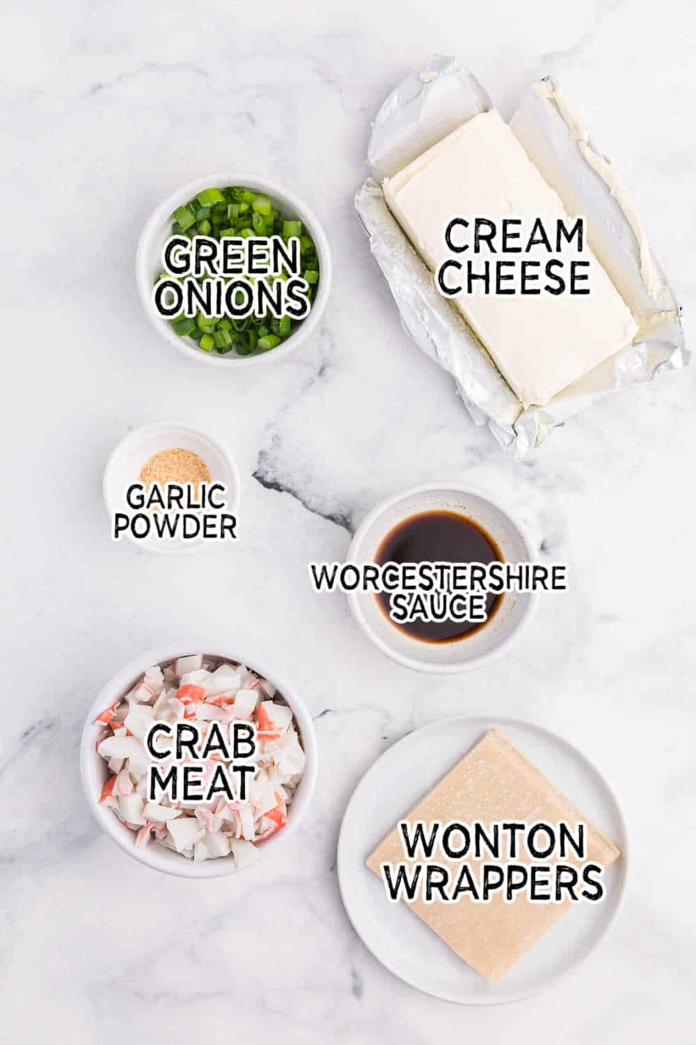 Ingredients on a white marble counter.