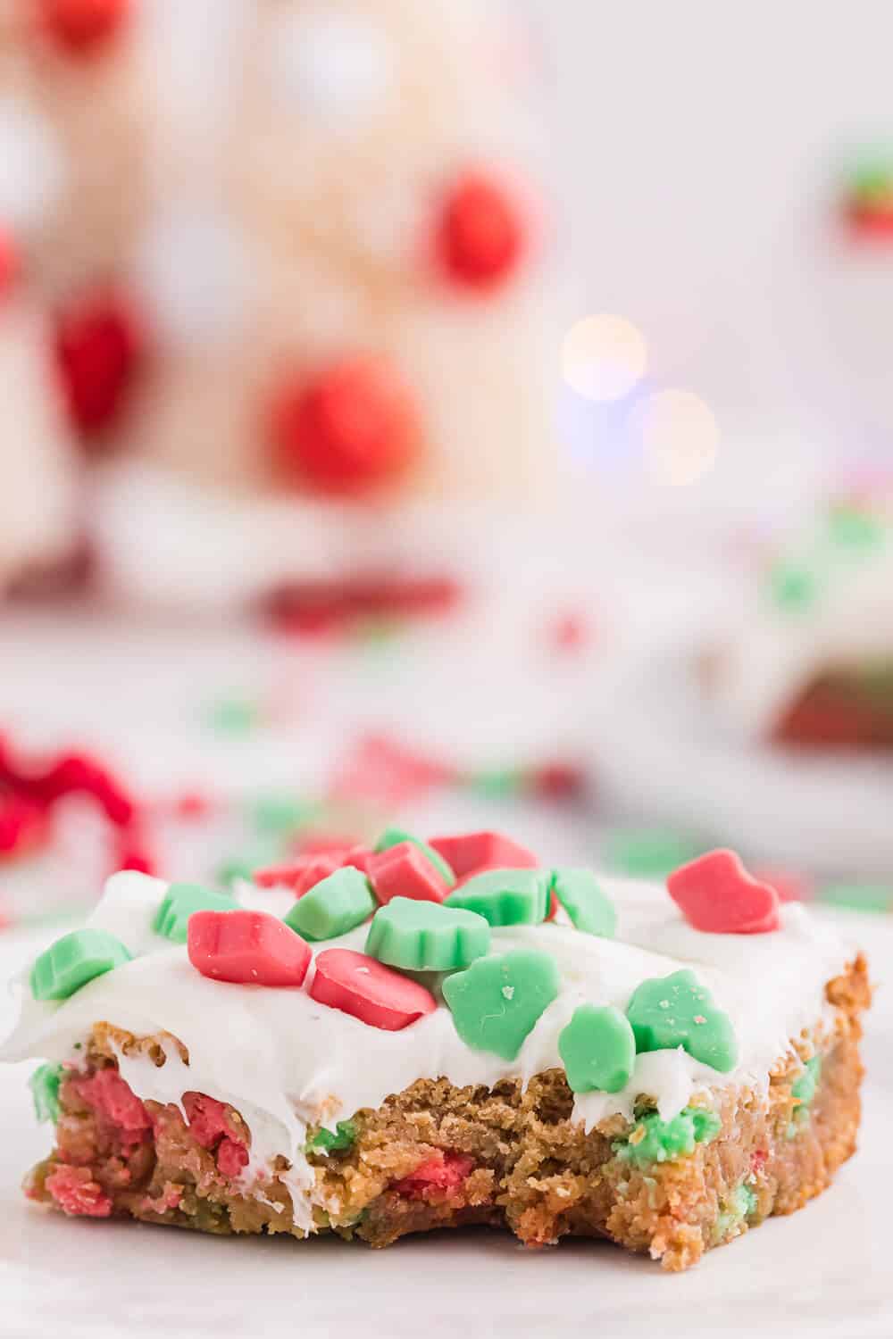 a christmas chewy bar on a plate with a bite out of it