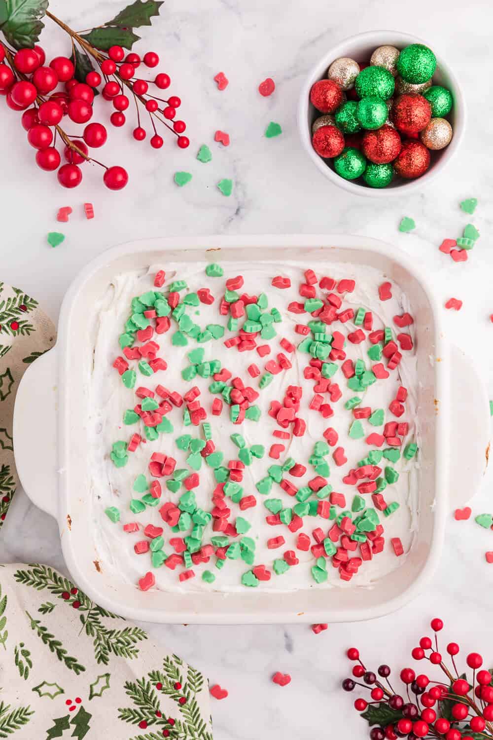 Christmas chewy bars in a white baking pan.