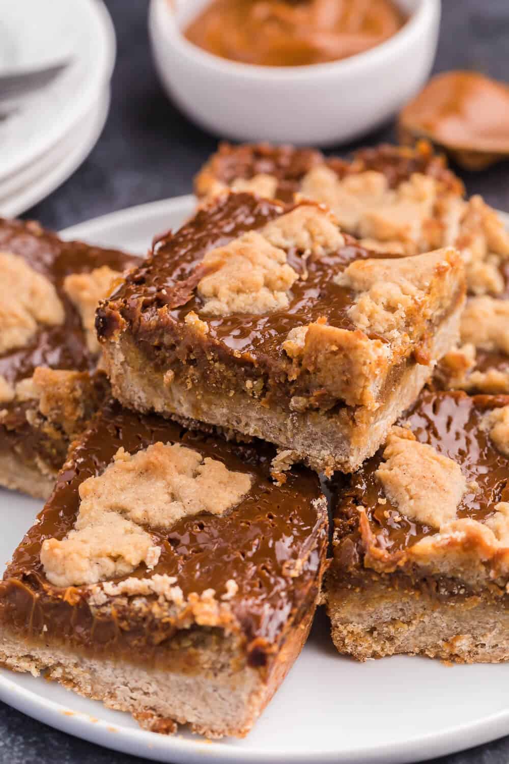 Dulce de Leche bars stacked on a plate.