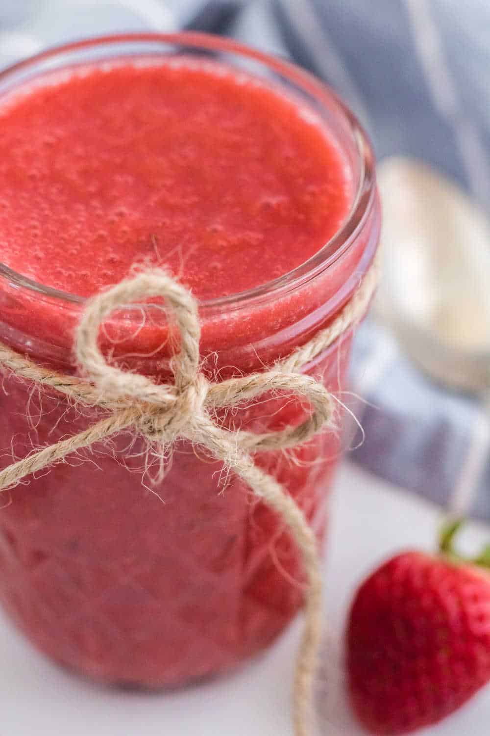 Instant Pot Strawberry Jam in a mason jar.