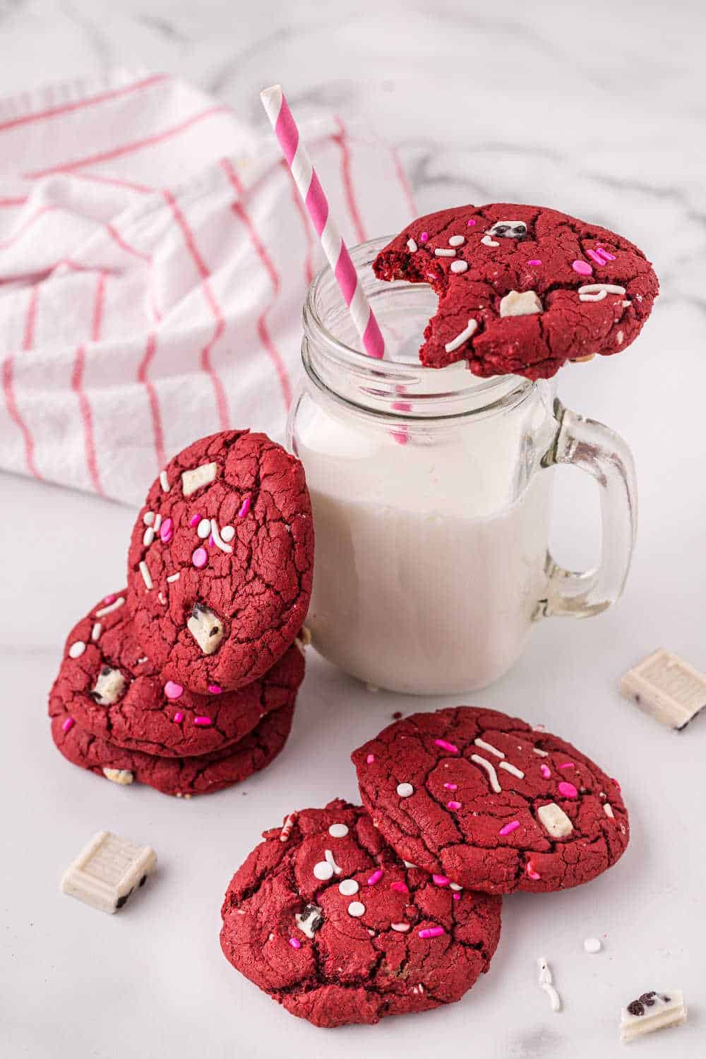 red velvet cookies with a glass milk