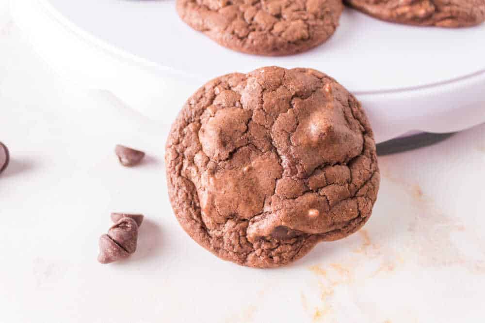 brownie mix cookie leaning against a white platter