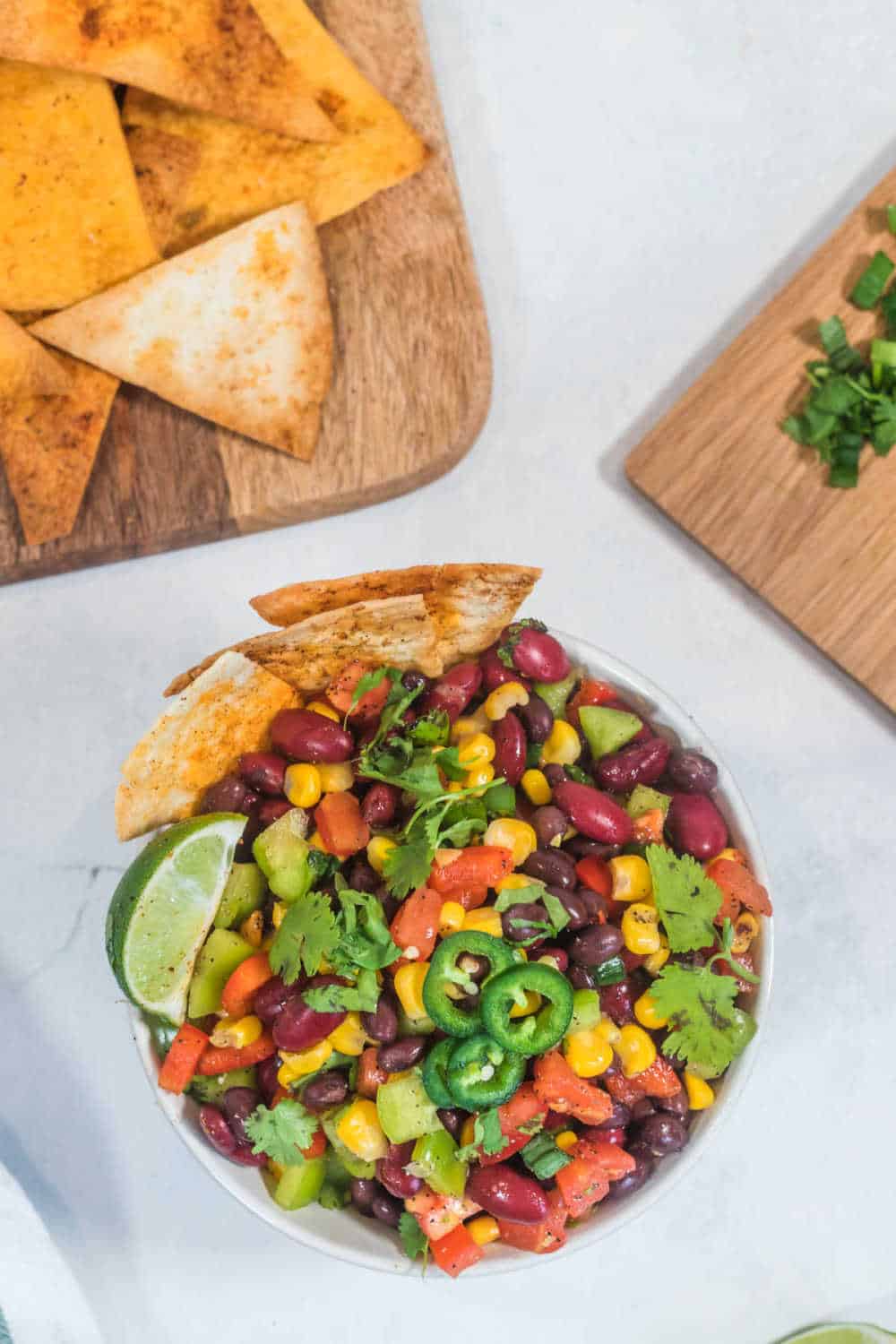 A bowl of Cowboy Caviar with tortilla chips.